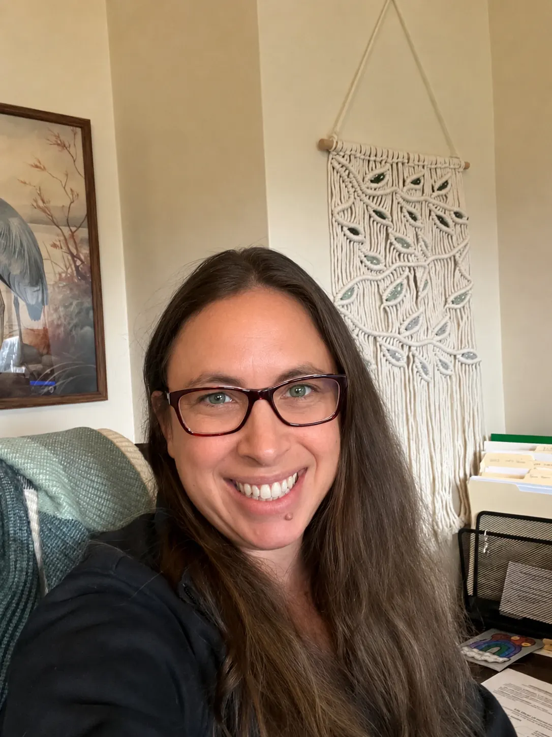 Margot Holmes, founder of Blue Heron Nonprofit Consulting, seated in her office.